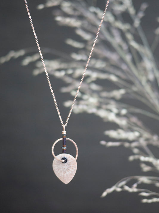 Nautilus Shaped Fossil Coral Pendant